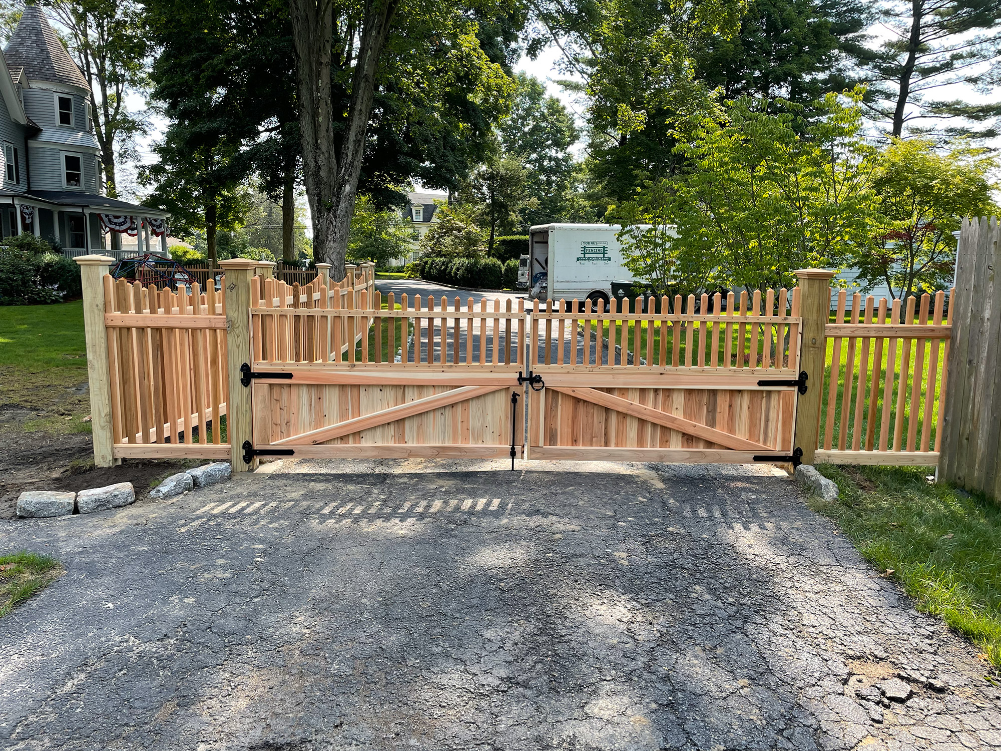 A wooden gate in Connecticut with fencing.